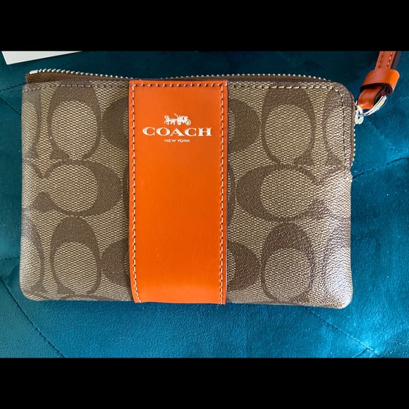 Coach Handbags - NWT Coach Wristlet Colorblock Sig Canvas Orang/Tan